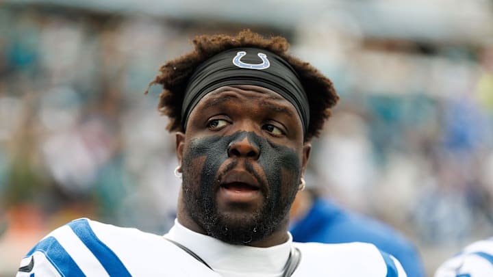 Former Indianapolis Colts defensive end Kwity Paye looks on