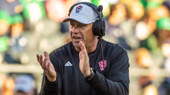 Oct 11, 2025; South Bend, Indiana, USA; NC State Wolfpack head coach Dave Doeren claps as he walks onto the field against the Notre Dame Fighting Irish during the second half at Notre Dame Stadium. Mandatory Credit: Michael Caterina-Imagn Images