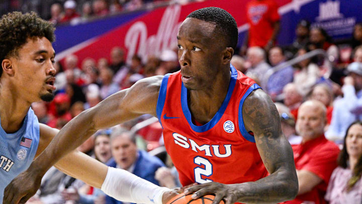 Jan 3, 2026; Dallas, Texas, USA; SMU Mustangs guard Boopie Miller (2) drives to the basket past North Carolina Tar Heels guard Seth Trimble (7) during the second half at Moody Coliseum. Mandatory Credit: Jerome Miron-Imagn Images Jan 3, 2026; Dallas, Texas, USA; SMU Mustangs guard Boopie Miller (2) drives to the basket past North Carolina Tar Heels guard Seth Trimble (7) during the second half at Moody Coliseum. Mandatory Credit: Jerome Miron-Imagn Images