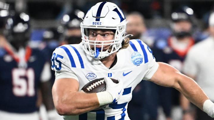 Dec 6, 2025; Charlotte, NC, USA; Duke Blue Devils tight end Jeremiah Hasley (85) runs the ball after a catch for a touchdown in the first quarter against the Virginia Cavaliers during the 2025 ACC Championship game at Bank of America Stadium. Mandatory Credit: Bob Donnan-Imagn Images