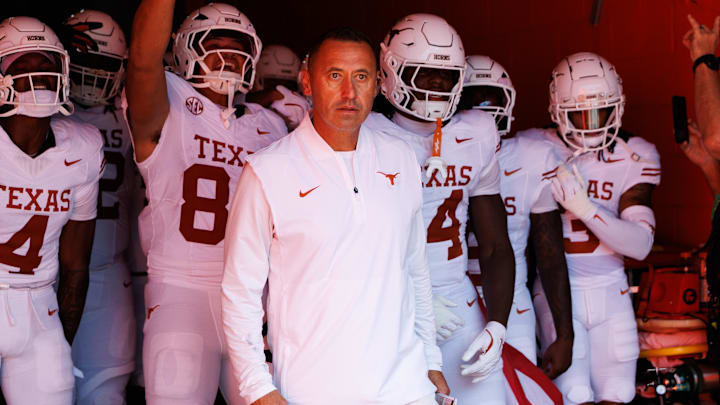 Texas Longhorns head coach Steve Sarkisian leads the team out of the tunnel before a game against the Florida Gators at Ben Hill Griffin Stadium.