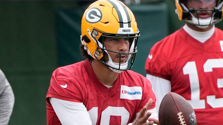 Green Bay Packers quarterback Jordan Love catches a snap at minicamp. Green Bay Packers quarterback Jordan Love catches a snap at minicamp.