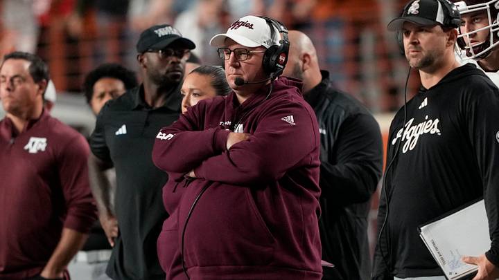 Head coach Mike Elko watches the first half of play against the Texas Longhorns at Darrell K Royal-Texas Memorial Stadium. Head coach Mike Elko watches the first half of play against the Texas Longhorns at Darrell K Royal-Texas Memorial Stadium.