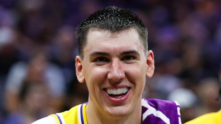 Oct 5, 2026; Sacramento, California, USA;  Los Angeles Lakers forward Jake LaRavia (12) smiles on the bench during the second quarter against the Sacramento Kings at Golden 1 Center.  Mandatory Credit: Sergio Estrada-Imagn Images