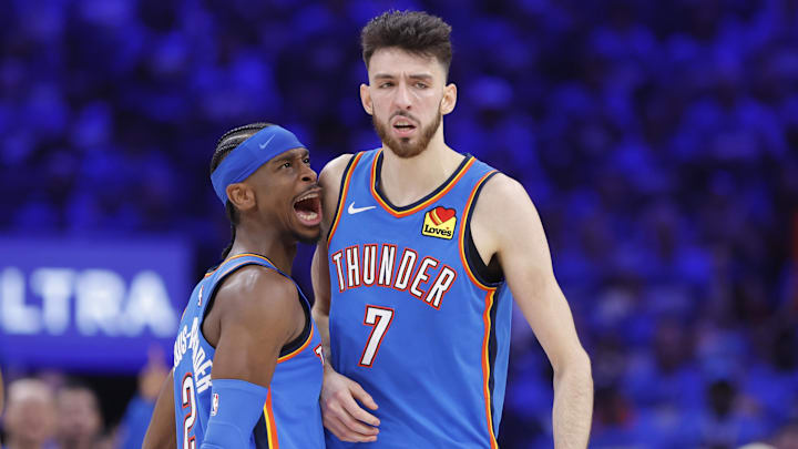 May 22, 2025; Oklahoma City, Oklahoma, USA; Oklahoma City Thunder guard Shai Gilgeous-Alexander (2) and forward Chet Holmgren (7) celebrate after a play against the Minnesota Timberwolves in the third quarter during game two of the western conference finals for the 2025 NBA Playoffs at Paycom Center. Mandatory Credit: Alonzo Adams-Imagn Images