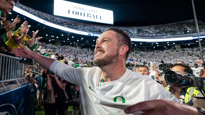 Oregon head coach Dan Lanning celebrates his win with Duck fans as the Oregon Ducks face the Penn State Nittany Lions on Sept. 27, 2025, at Beaver Stadium in University Park, Pennsylvania.