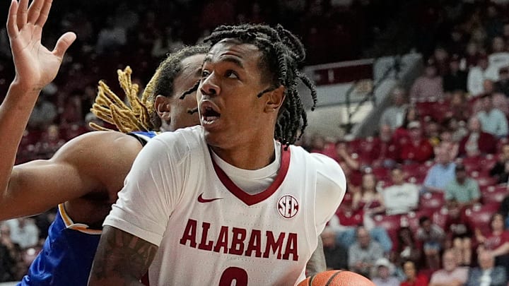 Nov 11, 2024; Tuscaloosa, AL, USA; Alabama guard Labaron Philon (0) drives into the lane against McNeese guard Brandon Murray (23) at Coleman Coliseum. Mandatory Credit: Gary Cosby Jr.-Tuscaloosa News