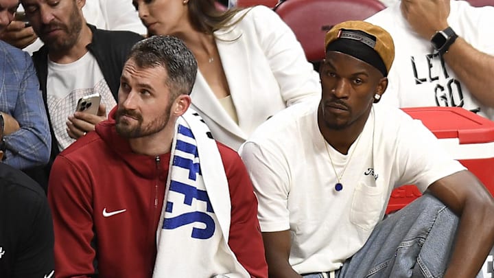 Apr 29, 2024; Miami, Florida, USA; Miami Heat forward Kevin Love (42) and Jimmy Butler (22) watch the Heat fall to the Boston Celtics during the fourth quarter of game four of the first round for the 2024 NBA playoffs at Kaseya Center. Mandatory Credit: Michael Laughlin-Imagn Images