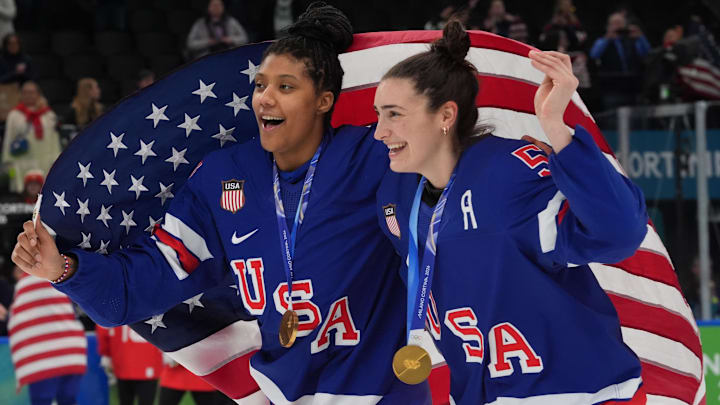 Feb 19, 2026; Milan, Italy; Laila Edwards (10) of the United States and Megan Keller (5) of the United States celebrate after winning the gold medal in women's ice hockey after defeating Canada during the Milano Cortina 2026 Olympic Winter Games at Milano Santagiulia Ice Hockey Arena. Mandatory Credit: Amber Searls-Imagn Images Feb 19, 2026; Milan, Italy; Laila Edwards (10) of the United States and Megan Keller (5) of the United States celebrate after winning the gold medal in women's ice hockey after defeating Canada during the Milano Cortina 2026 Olympic Winter Games at Milano Santagiulia Ice Hockey Arena. Mandatory Credit: Amber Searls-Imagn Images