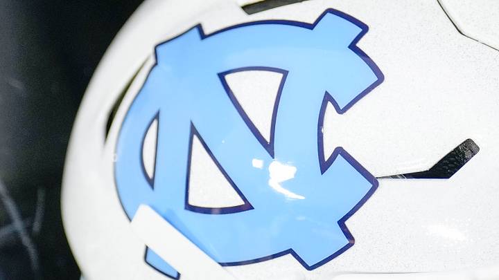 Dec 27, 2023; Charlotte, NC, USA; North Carolina Tar Heels white helmet during pregame warm ups against the West Virginia Mountaineers at Bank of America Stadium. Mandatory Credit: Jim Dedmon-USA TODAY Sports