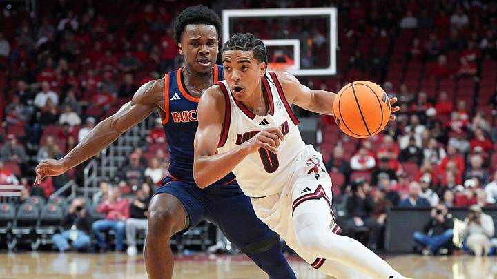 Louisville Cardinals guard Mikel Brown Jr. (0) drives by Bucknell Bison guard Jayden Williams (2) during an exhibition game at the KFC Yum! Center in Louisville, Kentucky Tuesday October 28, 2025.