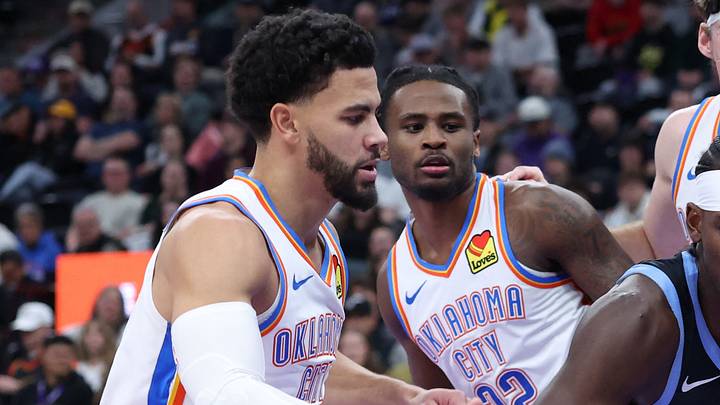 Dec 7, 2025; Salt Lake City, Utah, USA; Utah Jazz forward Taylor Hendricks (0) goes to the basket against Oklahoma City Thunder guard Ajay Mitchell (left), guard Cason Wallace (22) and center Branden Carlson (back) during the second half at Delta Center. Mandatory Credit: Rob Gray-Imagn Images