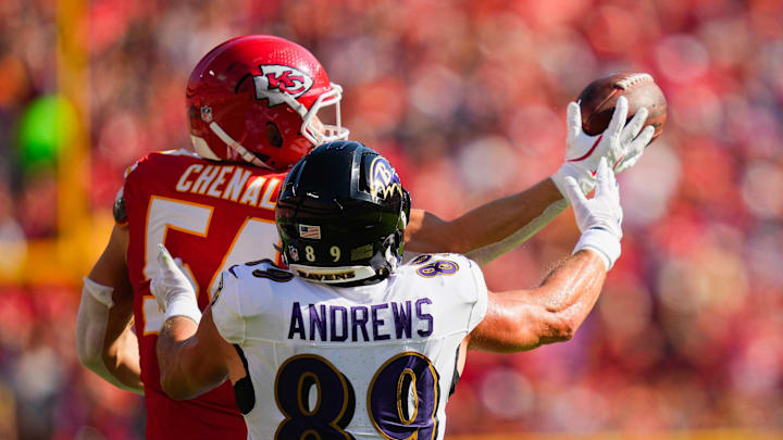 Sep 28, 2025; Kansas City, Missouri, USA; Kansas City Chiefs linebacker Leo Chenal (54) breaks up a pass to Baltimore Ravens tight end Mark Andrews (89) during the first half at GEHA Field at Arrowhead Stadium. Mandatory Credit: Jay Biggerstaff-Imagn Images