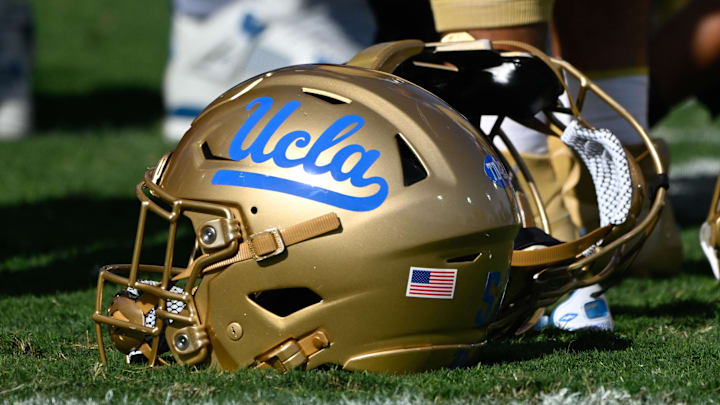 Nov 30, 2024; Pasadena, California, USA; UCLA Bruins helmets during pregame warmups before playing the Fresno State Bulldogs at Rose Bowl. Mandatory Credit: Robert Hanashiro-Imagn Images Nov 30, 2024; Pasadena, California, USA; UCLA Bruins helmets during pregame warmups before playing the Fresno State Bulldogs at Rose Bowl. Mandatory Credit: Robert Hanashiro-Imagn Images