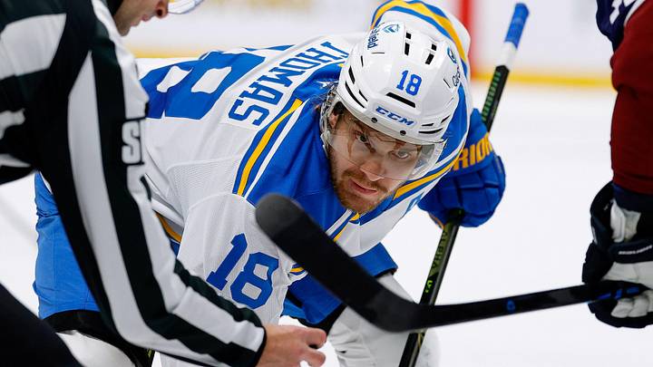 Apr 5, 2026; Denver, Colorado, USA; St. Louis Blues center Robert Thomas (18) faces off against Colorado Avalanche center Brock Nelson (11) as linesman Travis Gawryletz (67) drops the puck in the third period at Ball Arena. Mandatory Credit: Isaiah J. Downing-Imagn Images