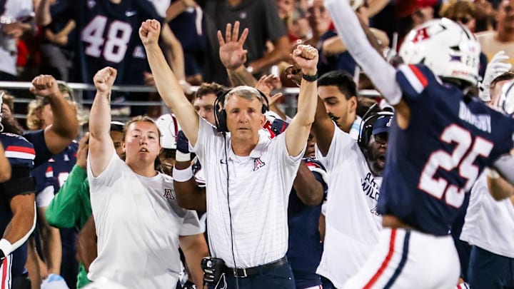 Sep 12, 2025; Tucson, Arizona, USA; Arizona Wildcats head coach Brent Brennan celebrates as defensive back Dalton Johnson (43) recovers the ball during the second quarter of the game against the Kansas State Wildcats at Arizona Stadium. Mandatory Credit: Aryanna Frank-Imagn Images