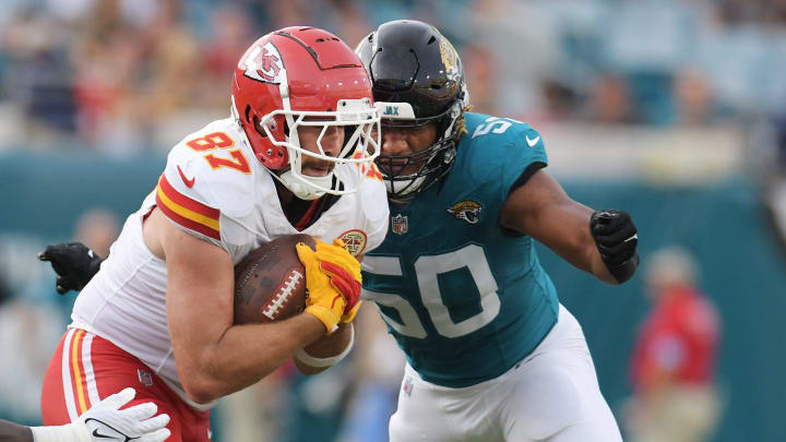 Jacksonville Jaguars defensive end Trevis Gipson (50) tries to tackle on Kansas City Chiefs tight end Travis Kelce (87) during first quarter action. The Jaguars led 20 to 10 at the end of the first half. The Jacksonville Jaguars hosted the Kansas City Chiefs in the Jaguars first preseason game of the season Saturday, August10, 2024 at EverBank Stadium in Jacksonville, Fla. [Bob Self/Florida Times-Union]