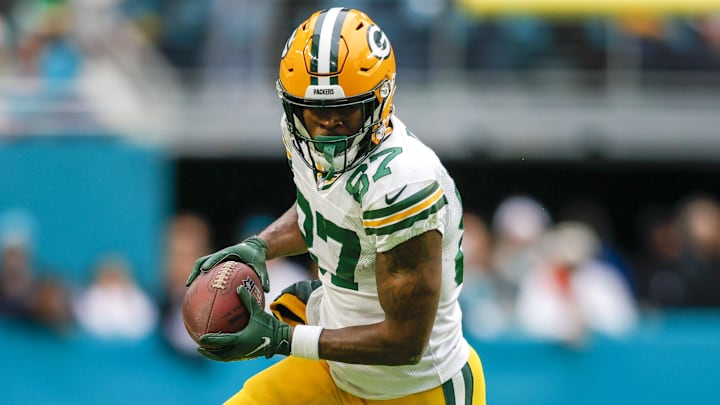 Dec 25, 2022; Miami Gardens, Florida, USA; Green Bay Packers wide receiver Romeo Doubs (87) runs with the football during the fourth quarter against the Miami Dolphins at Hard Rock Stadium. Mandatory Credit: Sam Navarro-Imagn Images