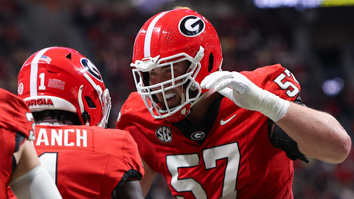 Nov 28, 2025; Atlanta, Georgia, USA; Georgia Bulldogs wide receiver Zachariah Branch (1) celebrates with offensive lineman Monroe Freeling (57) after a touchdown catch against the Georgia Tech Yellow Jackets in the second quarter at Mercedes-Benz Stadium. Mandatory Credit: Brett Davis-Imagn Images
