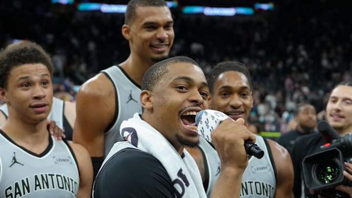 Mar 19, 2026; San Antonio, Texas, USA; San Antonio Spurs forward Keldon Johnson (3) addresses the crowd in front of forwards Carter Bryant (11), Victor Wembanyama (1), and guard Devin Vassell (24) after the game against the Phoenix Suns at Frost Bank Center. Mandatory Credit: Daniel Dunn-Imagn Images Mar 19, 2026; San Antonio, Texas, USA; San Antonio Spurs forward Keldon Johnson (3) addresses the crowd in front of forwards Carter Bryant (11), Victor Wembanyama (1), and guard Devin Vassell (24) after the game against the Phoenix Suns at Frost Bank Center. Mandatory Credit: Daniel Dunn-Imagn Images