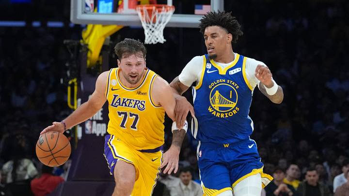 Los Angeles, California, USA; Los Angeles Lakers guard Luka Doncic (77) drives to the basket against Golden State Warriors forward Yaxel Lendeborg (1) in the first half at Crypto.com Arena. Mandatory Credit: Kirby Lee-Imagn Images
