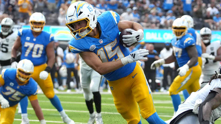 Sep 8, 2024; Inglewood, California, USA; Los Angeles Chargers wide receiver Ladd McConkey (15) scores on a 15-yard touchdown reception against Las Vegas Raiders safety Tre'von Moehrig (7) in the second half at SoFi Stadium. Mandatory Credit: Kirby Lee-Imagn Images Sep 8, 2024; Inglewood, California, USA; Los Angeles Chargers wide receiver Ladd McConkey (15) scores on a 15-yard touchdown reception against Las Vegas Raiders safety Tre'von Moehrig (7) in the second half at SoFi Stadium. Mandatory Credit: Kirby Lee-Imagn Images