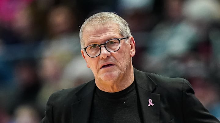 UConn Huskies head coach Geno Auriemma watches from the sideline.