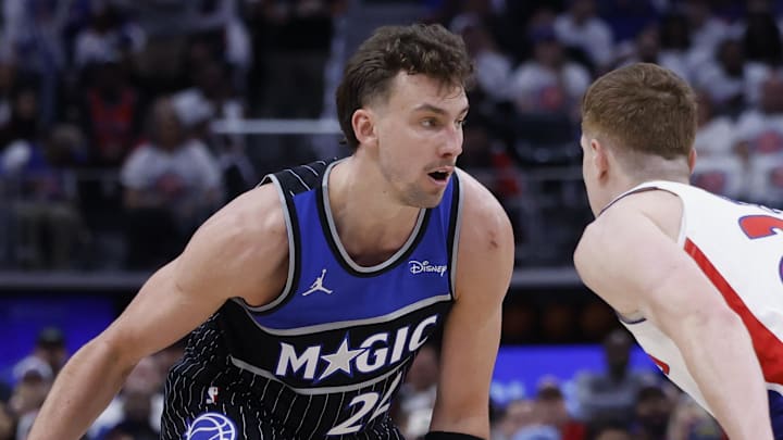 Apr 22, 2026; Detroit, Michigan, USA; Orlando Magic forward Franz Wagner (22) dribbles defended by Detroit Pistons guard Kevin Huerter (27) in the first half during game two of the first round of the 2026 NBA Playoffs at Little Caesars Arena. Mandatory Credit: Rick Osentoski-Imagn Images