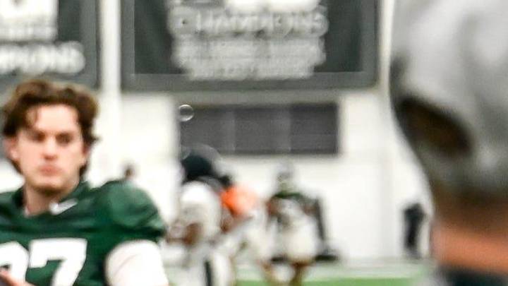 Michigan State's assistant head coach/special teams coordinator LeVar Woods talks with Tarik Ahmetbasic, left, and other on special teams during spring football practice on Tuesday, April 14, 2026, in East Lansing.