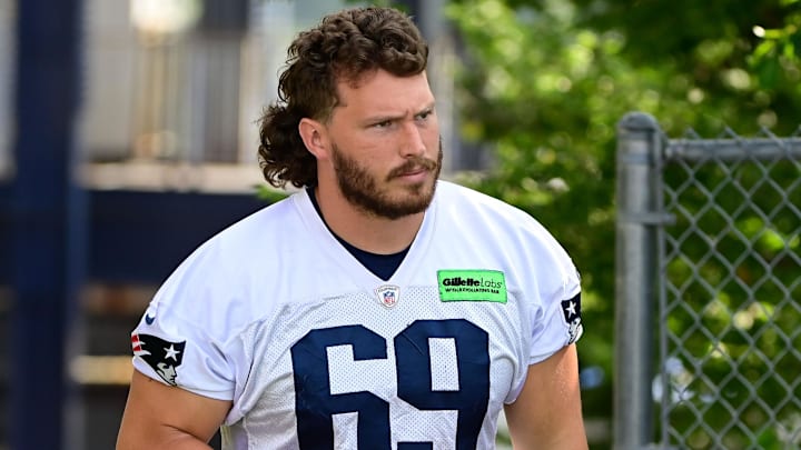 Jul 26, 2023; Foxborough, MA, USA; New England Patriots guard Cole Strange (69) makes his way to the practice fields for  training camp at Gillette Stadium. Mandatory Credit: Eric Canha-Imagn Images