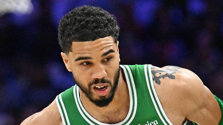 Apr 26, 2026; Philadelphia, Pennsylvania, USA; Boston Celtics forward Jayson Tatum (0) drives to the basket past Philadelphia 76ers forward Paul George (8) during the first half at Xfinity Mobile Arena. Mandatory Credit: Eric Hartline-Imagn Images