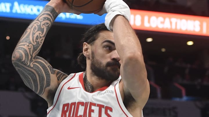 Dec 23, 2024; Charlotte, North Carolina, USA;  Houston Rockets center Steven Adams (12) gets rebound during the second half against the Charlotte Hornets at the Spectrum Center. Mandatory Credit: Sam Sharpe-Imagn Images