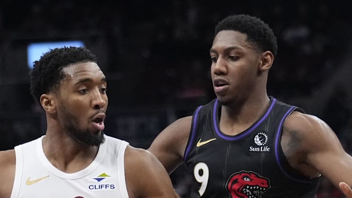 Cleveland Cavaliers guard Donovan Mitchell drives to the net against Toronto Raptors guard RJ Barrett. Cleveland Cavaliers guard Donovan Mitchell drives to the net against Toronto Raptors guard RJ Barrett.