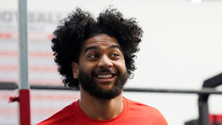 Indianapolis Colts defensive end Jaylahn Tuimoloau reaches for his high jump