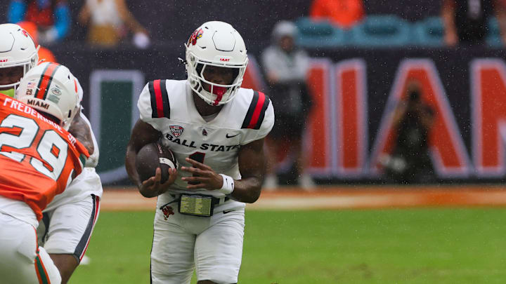 Sep 14, 2024; Miami Gardens, Florida, USA; Ball State Cardinals wide receiver Justin Bowick (1) runs with the football against the Miami Hurricanes during the first quarter at Hard Rock Stadium. Mandatory Credit: Sam Navarro-Imagn Images