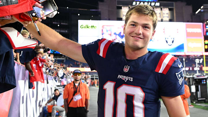 Aug 8, 2025; Foxborough, Massachusetts, USA; New England Patriots quarterback Drake Maye (10) signs autographs after a game against the Washington Commanders during the second half at Gillette Stadium. Mandatory Credit: Brian Fluharty-Imagn Images