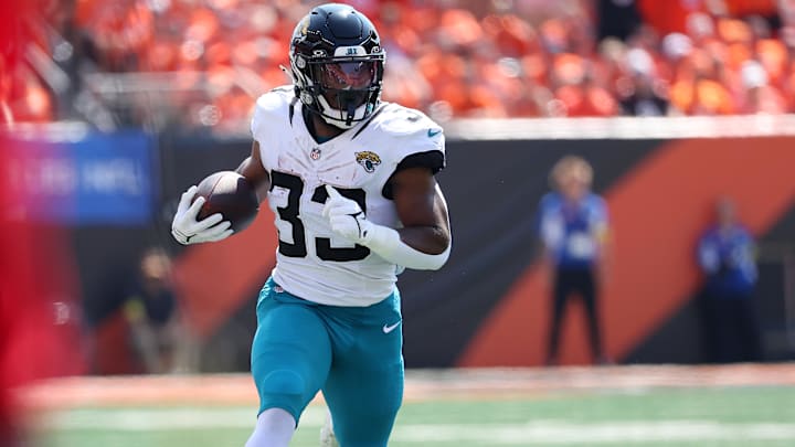 Sep 14, 2025; Cincinnati, Ohio, USA; Jacksonville Jaguars running back Bhayshul Tuten (33) runs the ball during the first quarter against the Cincinnati Bengals at Paycor Stadium. Mandatory Credit: Joseph Maiorana-Imagn Images Sep 14, 2025; Cincinnati, Ohio, USA; Jacksonville Jaguars running back Bhayshul Tuten (33) runs the ball during the first quarter against the Cincinnati Bengals at Paycor Stadium. Mandatory Credit: Joseph Maiorana-Imagn Images
