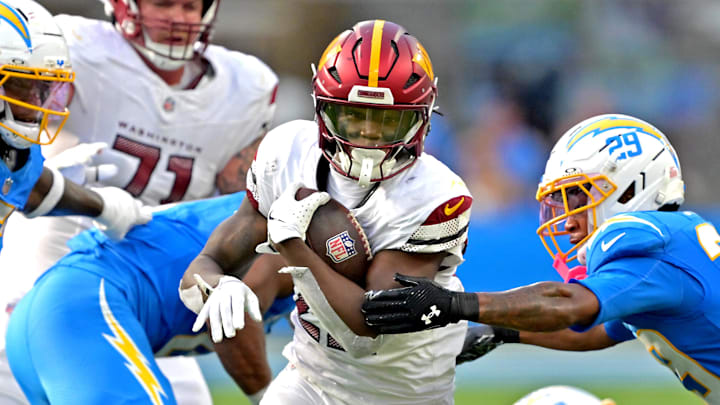 Oct 5, 2025; Inglewood, California, USA; Washington Commanders running back Jacory Croskey-Merritt (22) runs past Los Angeles Chargers defense at SoFi Stadium. Mandatory Credit: Jayne Kamin-Oncea-Imagn Images Oct 5, 2025; Inglewood, California, USA; Washington Commanders running back Jacory Croskey-Merritt (22) runs past Los Angeles Chargers defense at SoFi Stadium. Mandatory Credit: Jayne Kamin-Oncea-Imagn Images