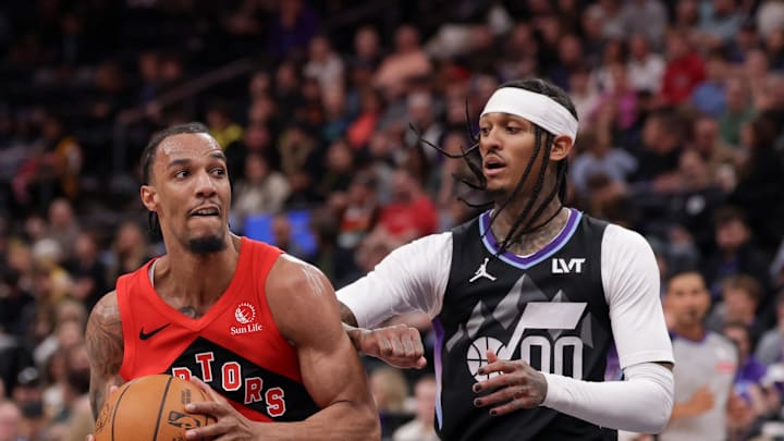 Toronto Raptors guard A.J. Lawson gets past Utah Jazz guard Jordan Clarkson.