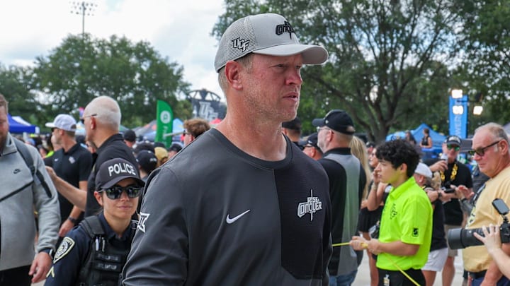 Sep 20, 2025; Orlando, Florida, USA; UCF Knights head coach Scott Frost walks into the venue before the game against the North Carolina Tar Heels at the Bounce House Stadium. Mandatory Credit: Mike Watters-Imagn Images