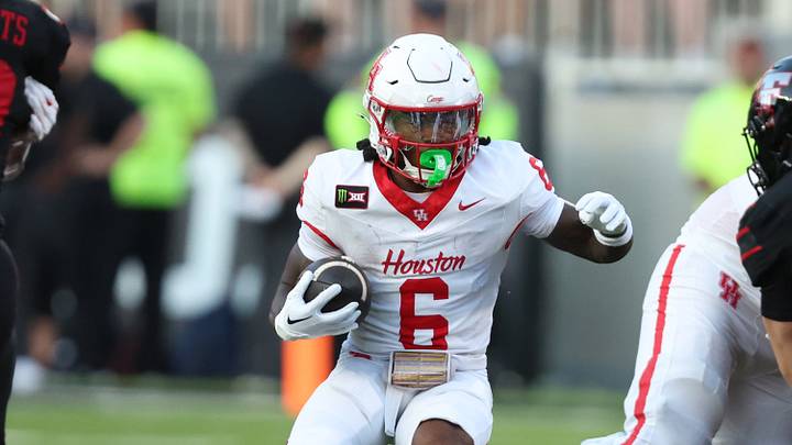 Sep 18, 2026; Lubbock, Texas, USA;  Houston Cougars running back Re'Shaun Sanford (6) rushes against the Texas Tech Red Raiders in the first half at Galaxy Stadium.  Mandatory Credit: Michael C. Johnson-Imagn Images