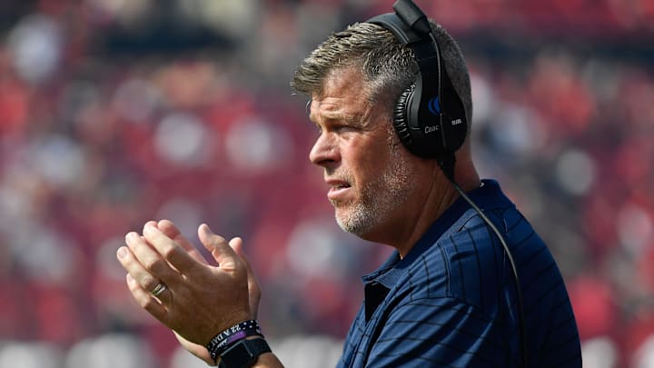 Oct 9, 2021; Louisville, Kentucky, USA; (Editors Notes: Caption Correction) Virginia Cavaliers offensive line coach Garett Tujague reacts on the sideline during the first half against the Louisville Cardinals at Cardinal Stadium. Virginia defeated Louisville 34-33. Mandatory Credit: Jamie Rhodes-Imagn Images Oct 9, 2021; Louisville, Kentucky, USA; (Editors Notes: Caption Correction) Virginia Cavaliers offensive line coach Garett Tujague reacts on the sideline during the first half against the Louisville Cardinals at Cardinal Stadium. Virginia defeated Louisville 34-33. Mandatory Credit: Jamie Rhodes-Imagn Images