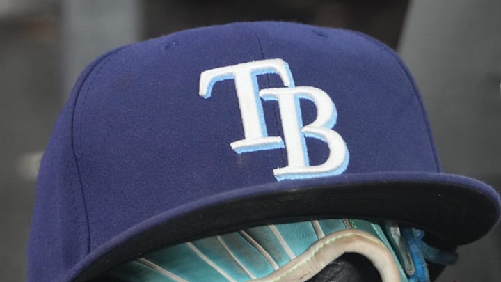 Sep 26, 2025; Toronto, Ontario, CAN; The hat and glove of Tampa Bay Rays third baseman Junior Caminero (13) in the dugout during the game against the Toronto Blue Jays at Rogers Centre. 