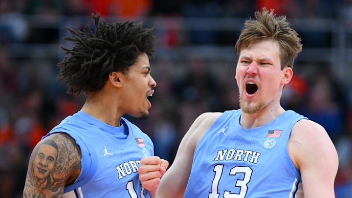 Feb 21, 2026; Syracuse, New York, USA; North Carolina Tar Heels forward Jonathan Powell (11) and center Henri Veesaar (13) react during the second half against the Syracuse Orange at the JMA Wireless Dome. Mandatory Credit: Rich Barnes-Imagn Images