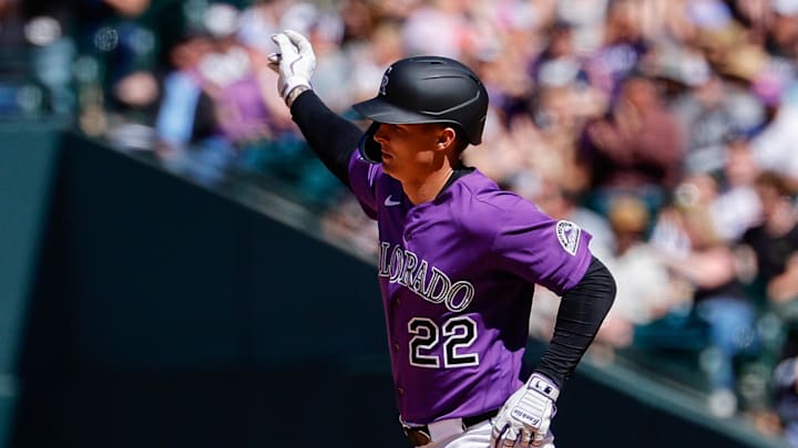 Colorado Rockies right fielder Mickey Moniak (22) rounds the bases on a solo home run. 