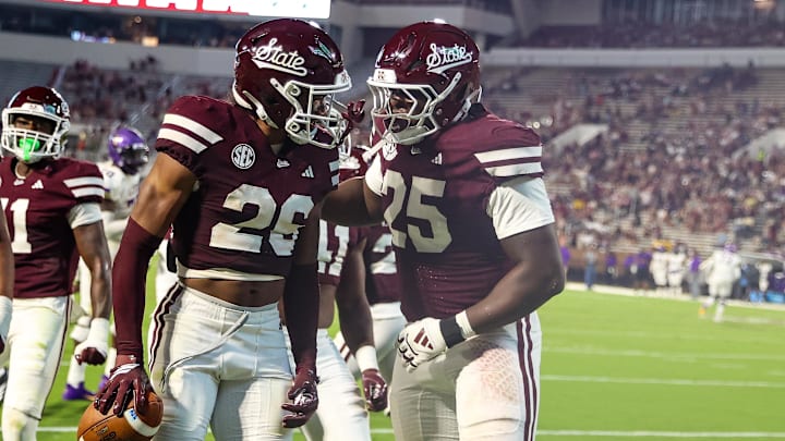 Mississippi State Bulldogs defensive back Dwight Lewis III (26) and defensive lineman Ray Thomas (25) celebrate after a touchdown against the Alcorn State Braves during the second half at Davis Wade Stadium at Scott Field.