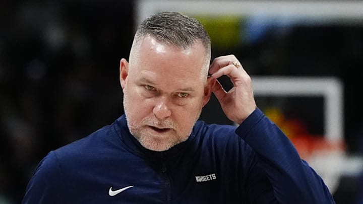 Mar 15, 2025; Denver, Colorado, USA; Denver Nuggets head coach Michael Malone following a timeout in the fourth quarter against the Washington Wizards at Ball Arena. Mandatory Credit: Ron Chenoy-Imagn Images