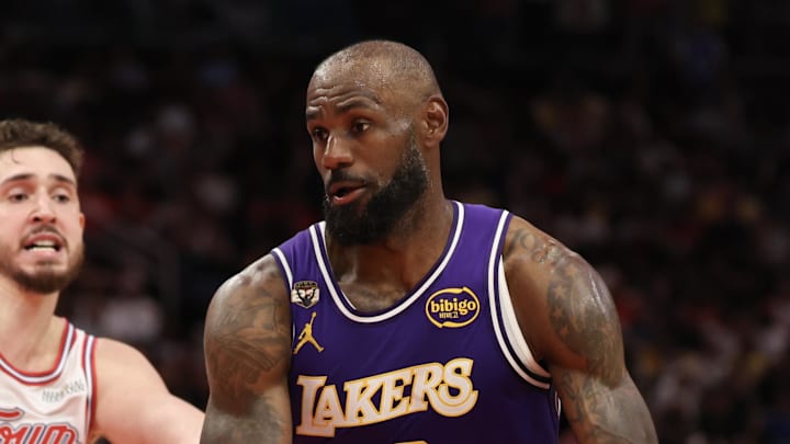 Mar 18, 2026; Houston, Texas, USA; Los Angeles Lakers forward LeBron James (23) splits the defense of Houston Rockets center Alperen Sengun (28) and guard Reed Sheppard (15) in the second half at Toyota Center. Mandatory Credit: Thomas Shea-Imagn Images