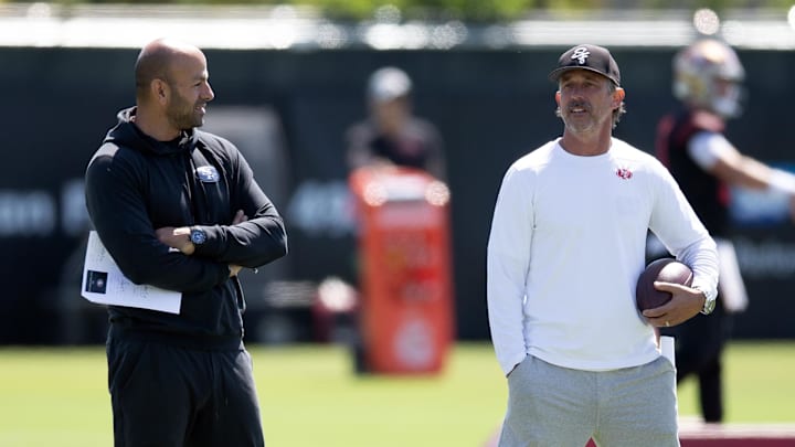 Jun 10, 2025; Santa Clara, CA, USA; San Francisco 49ers head coach Kyle Shanahan (right) and defensive coordinator Robert Saleh confer during an OTA at Levi's Stadium. Mandatory Credit: D. Ross Cameron-Imagn Images