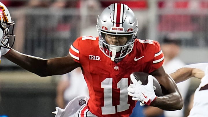 Ohio State Buckeyes wide receiver Quincy Porter (11) runs past the Minnesota Golden Gophers defense at Ohio Stadium.